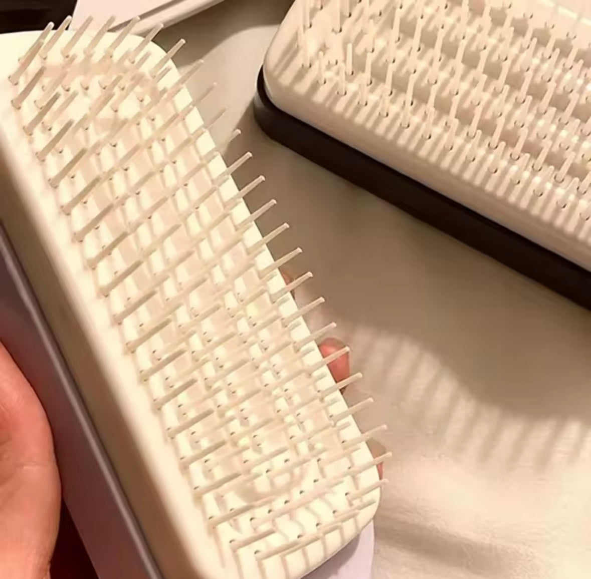 Cepillo de pelo autolimpiante